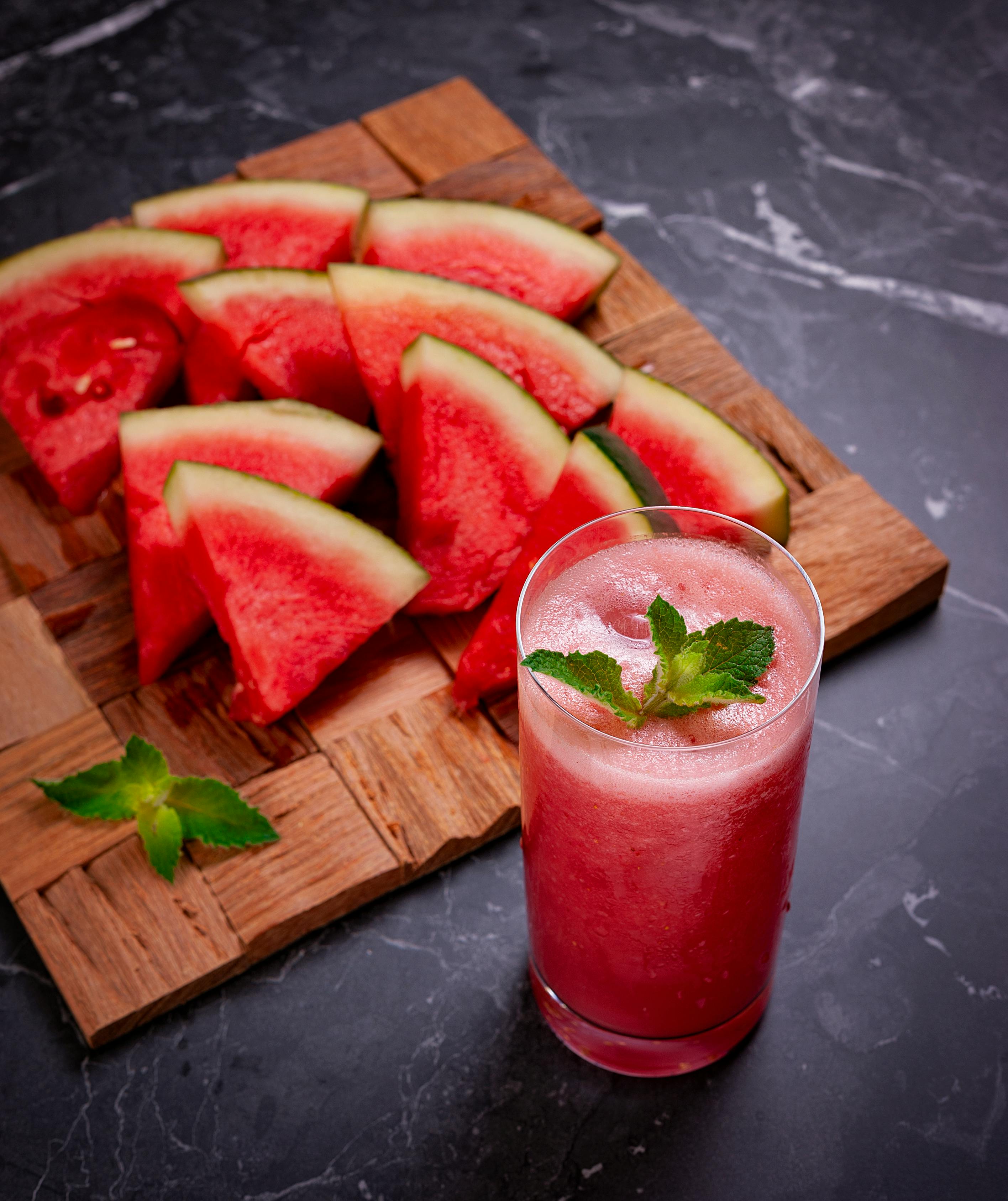 Charleston Gray Watermelon recipe ideas wooden tray with Charleston Gray Watermelon slices and a glass of slushie